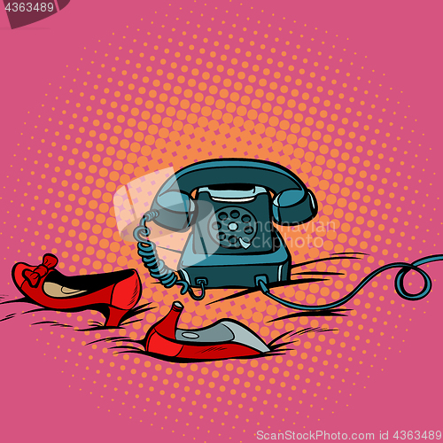 Image of retro phone and womens red shoes