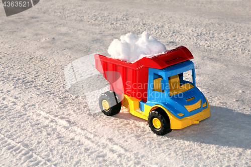 Image of toy truck removes snow