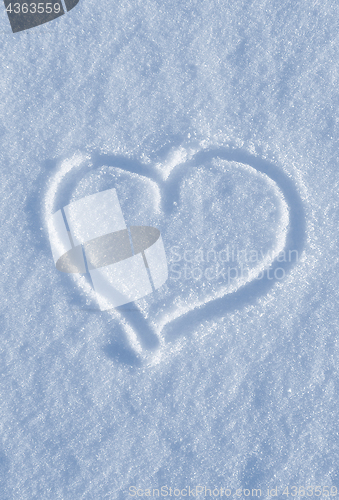 Image of Draw of heart on the white snow 