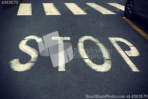 Image of City crosswalk with symbol stop