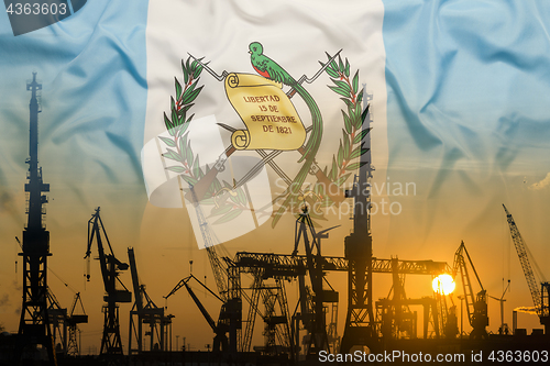 Image of Industrial concept with Guatemala flag at sunset