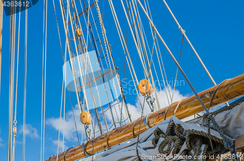 Image of Folded sail and mast on an old sailboat