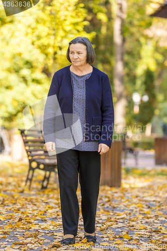 Image of Depressed senior woman outdoors