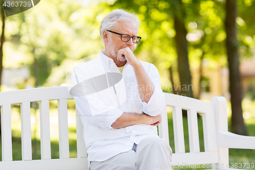 Image of thoughtful senior man at summer park