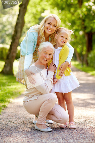 Image of happy mother, daughter and grandmother at park