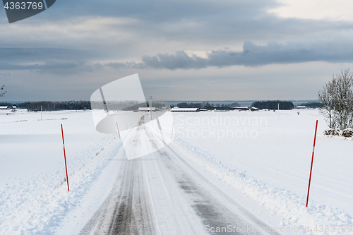 Image of Country road with snow stakes