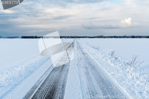 Image of Straight road in a wintry landscape