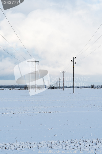 Image of Power lines in a snowy field