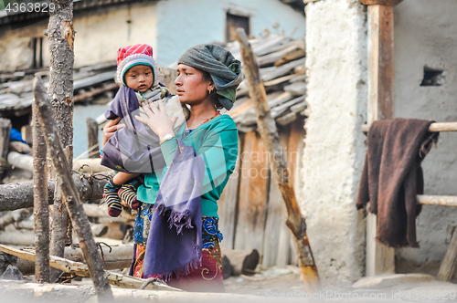 Image of Woman holding child in Nepal
