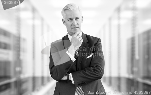 Image of Senior businessman in server room