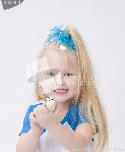 Image of Portrait of a cute girl with toy mouse