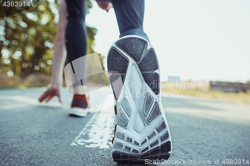 Image of Running sport. Man runner sprinting outdoor in scenic nature. Fit muscular male athlete training trail running for marathon run.