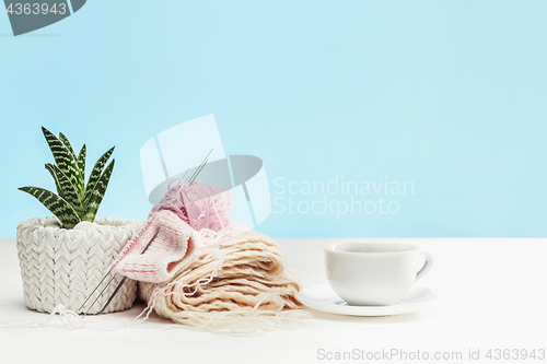 Image of The balls of wool on white wooden background