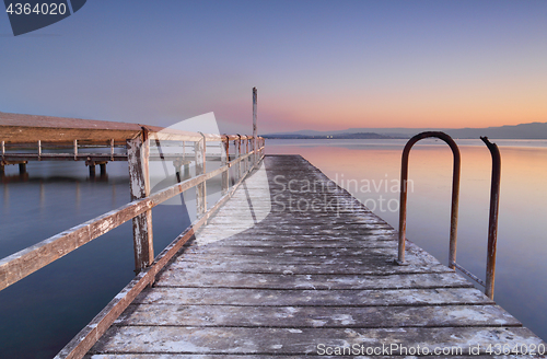 Image of Whitewashed jetty at dusk