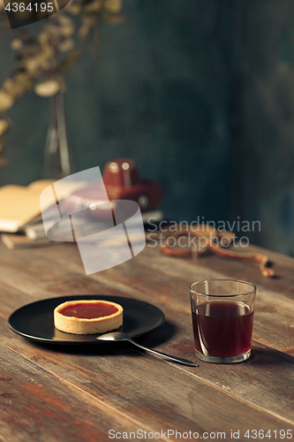 Image of Opened craft paper envelope , autumn leaves and coffee on wooden table