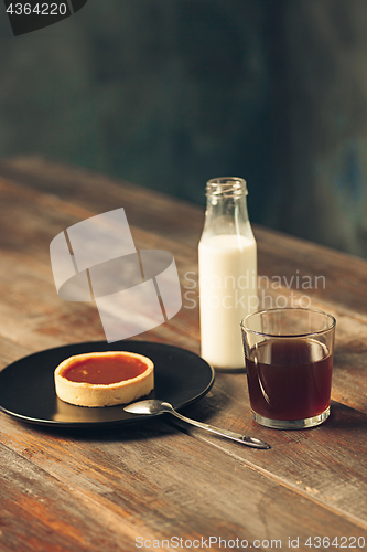 Image of The cake on wooden table