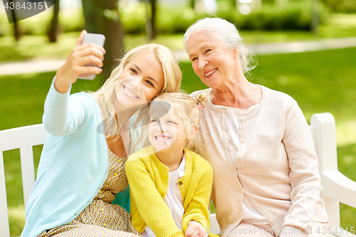 Image of mother with daughter and grandmother at park