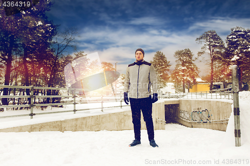 Image of sports man in winter outdoors