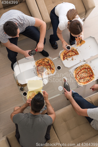 Image of Pizza time a group of people