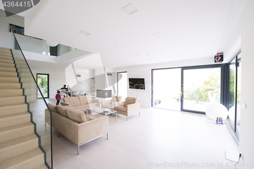 Image of family with little girl enjoys in the modern living room