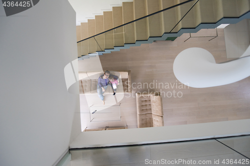 Image of mother and her cute little daughter are using a tablet top view