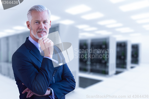 Image of Senior businessman in server room