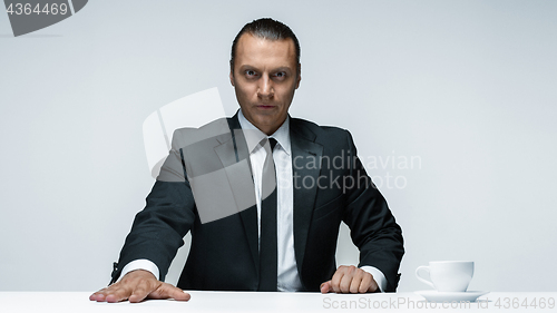 Image of The attractive man in black suit on white background