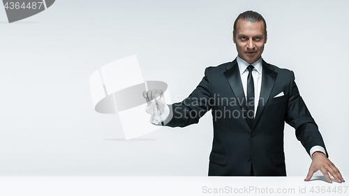 Image of At Your service, well dressed man waiting for orders isolated on white background with copy space