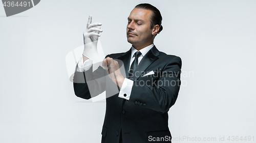 Image of At Your service, well dressed man waiting for orders isolated on white background with copy space