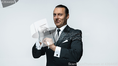 Image of At Your service, well dressed man waiting for orders isolated on white background with copy space