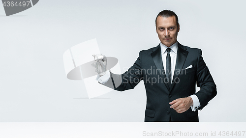 Image of At Your service, well dressed man waiting for orders isolated on white background with copy space