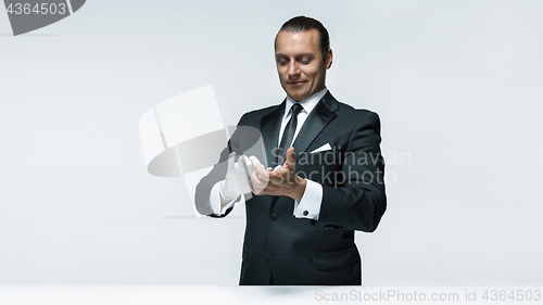 Image of At Your service, well dressed man waiting for orders isolated on white background with copy space