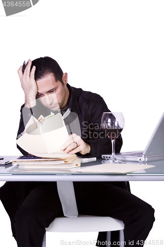 Image of Stressed Businessman at His Desk Working