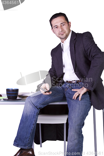 Image of Businessman Sitting At His Desk