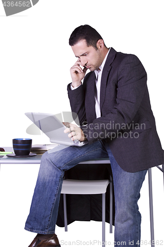 Image of Businessman Sitting At His Desk