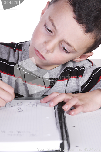 Image of Little Cute Boy Practicing His Writing Skills