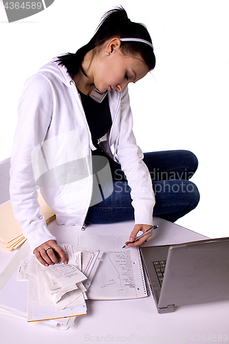 Image of Teen Girl Paying Bills and Making a To Do List