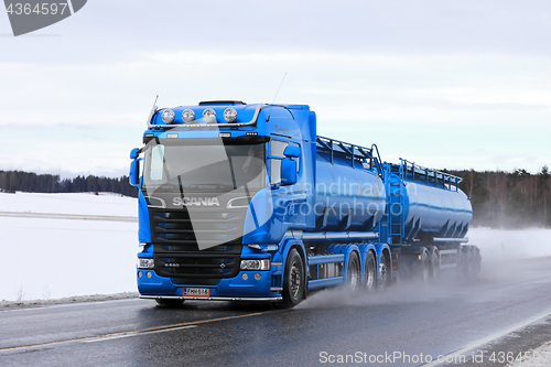 Image of Blue Scania Tank Truck on Wet Highway