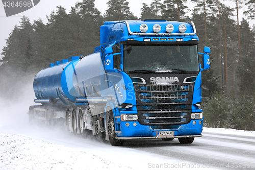 Image of Blue Scania Tank Truck on Snowy Road