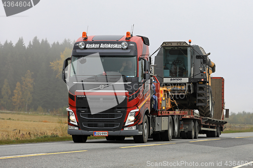 Image of Volvo FH Semi Trailer Hauls Combine