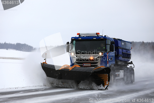 Image of Snowplow Clears Highway 