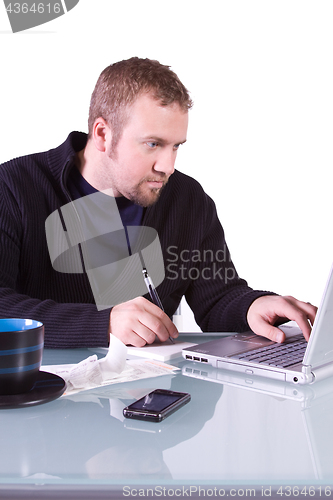 Image of Young Casual Businessman Working at his Desk