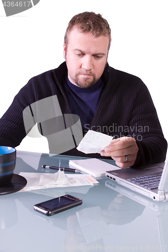 Image of Young Casual Businessman Working at his Desk