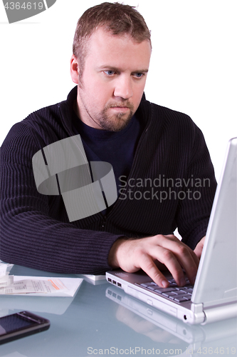 Image of Young Casual Businessman Working at his Desk