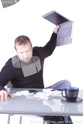 Image of Frustrated Young Casual Businessman Working at his Desk