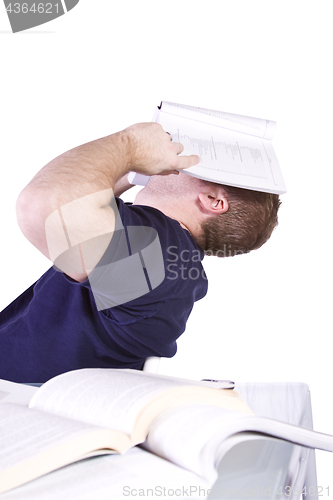 Image of Tired College Student with Books on the Table Studying