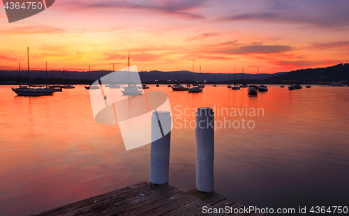 Image of Boats on the harbour at sunset