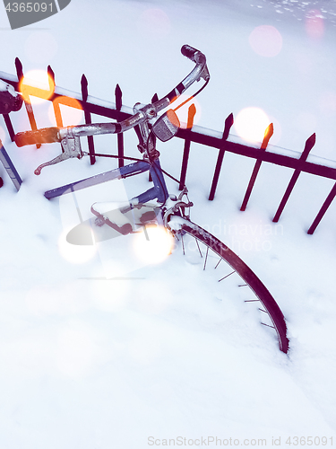 Image of Bicycle in snow, with bokeh light effect