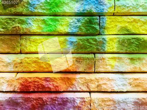 Image of Detail of bright graffiti on a stone wall