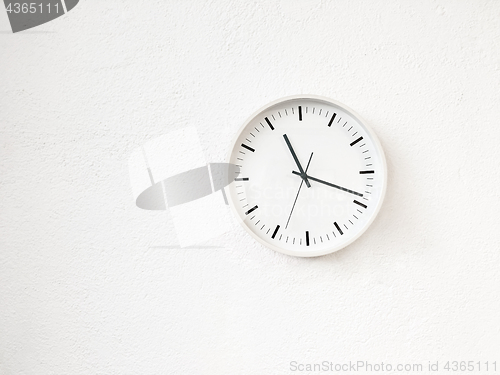 Image of Simple modern round clock on white wall